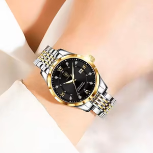 POEDAGAR 268 Quartz Analog Watch on wrist with black dial and gold and silver bracelet.