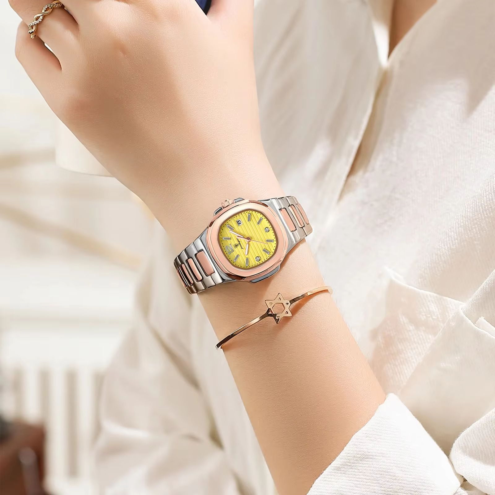 Person wearing POEDAGAR 708 Quartz Analog Watch with yellow dial and two-tone bracelet.