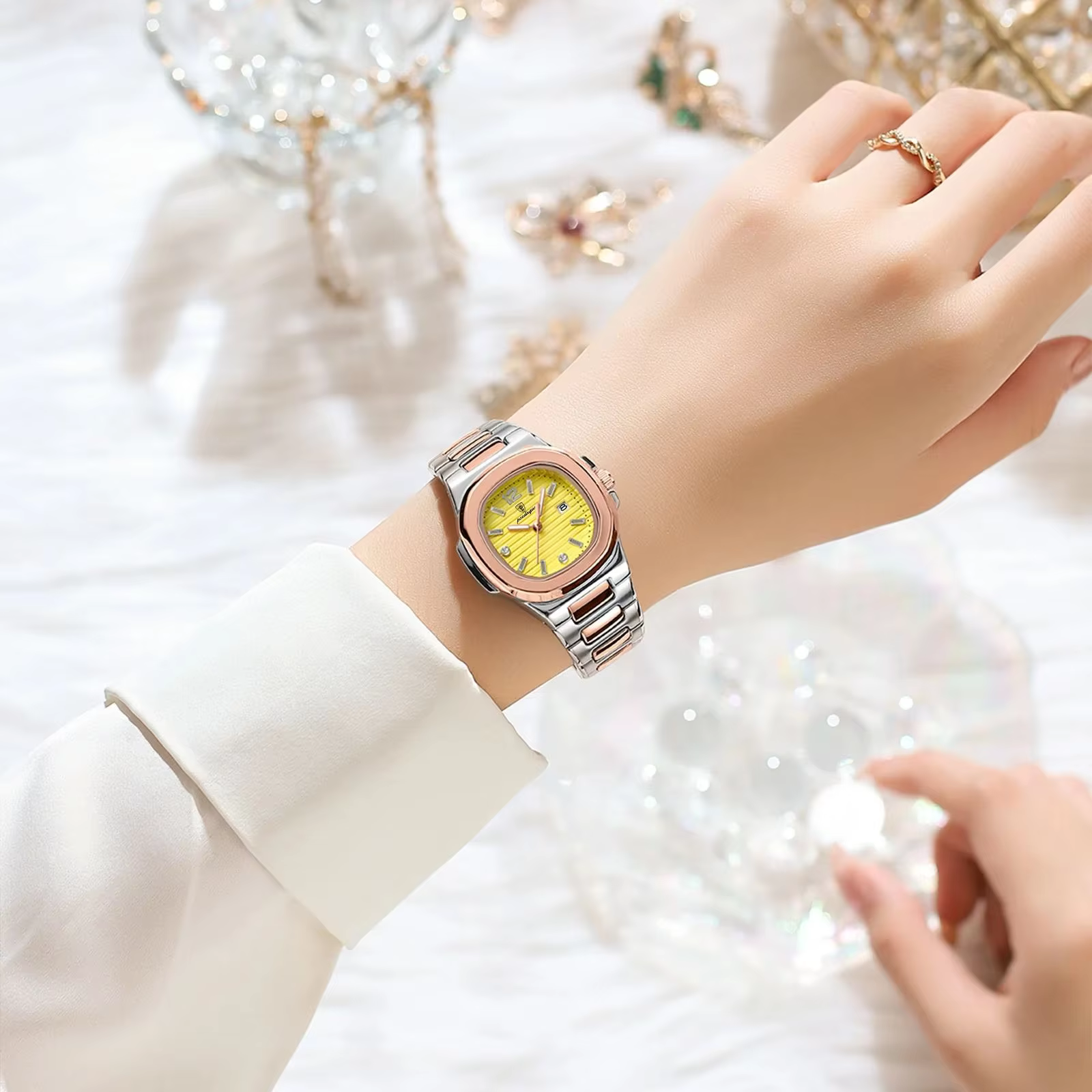 Woman wearing POEDAGAR 708 Quartz Analog Watch with yellow dial on wrist.