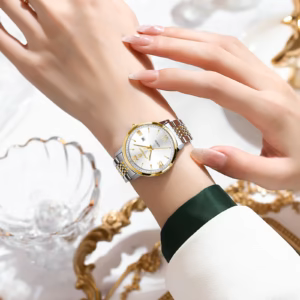 POEDAGAR 716 Quartz Analog Watch with white dial and silver and gold bracelet on wrist.
