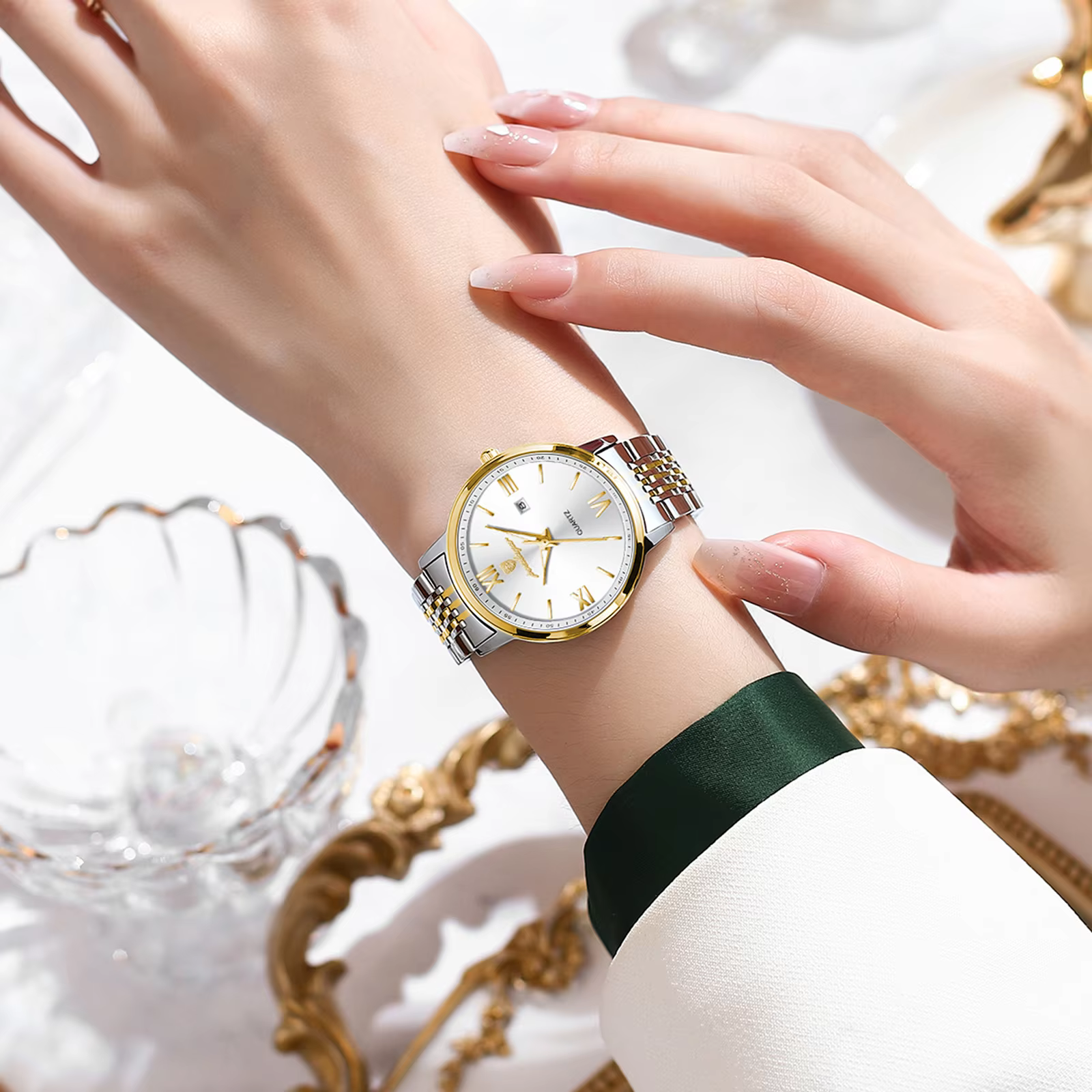 POEDAGAR 716 Quartz Analog Watch with white dial and silver and gold bracelet on wrist.
