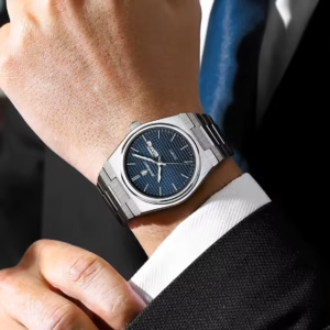 POEDAGAR 821 Quartz Analog Watch with blue dial and stainless steel band on wrist.