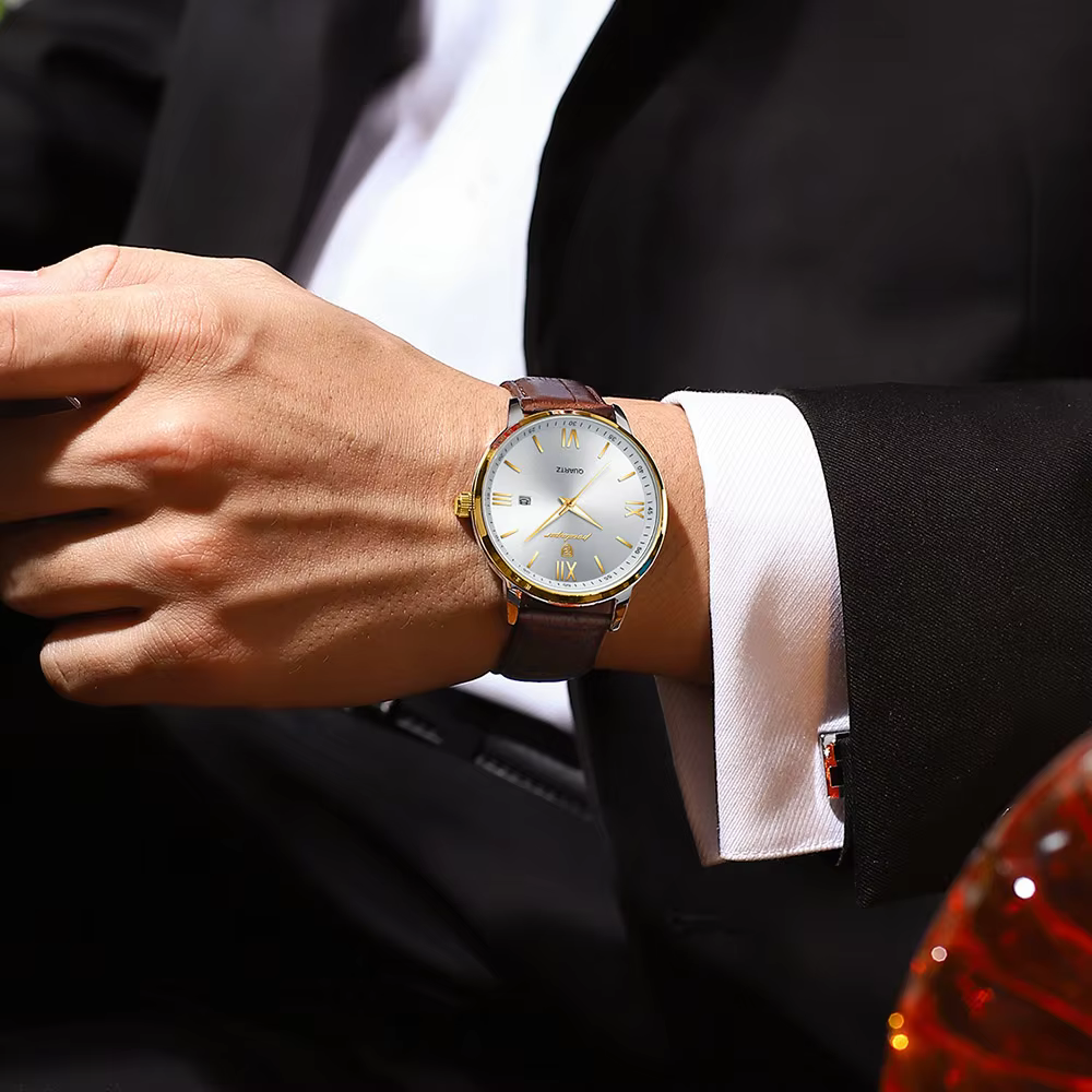 Person wearing a POEDAGAR 826L Quartz Analog Watch with a brown leather strap.