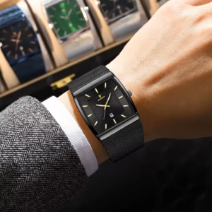 Black POEDAGAR 885 Quartz Analog Watch with black mesh strap worn on a wrist.