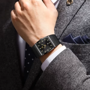 Black POEDAGAR 885 Quartz Analog Watch with mesh strap worn on a wrist.