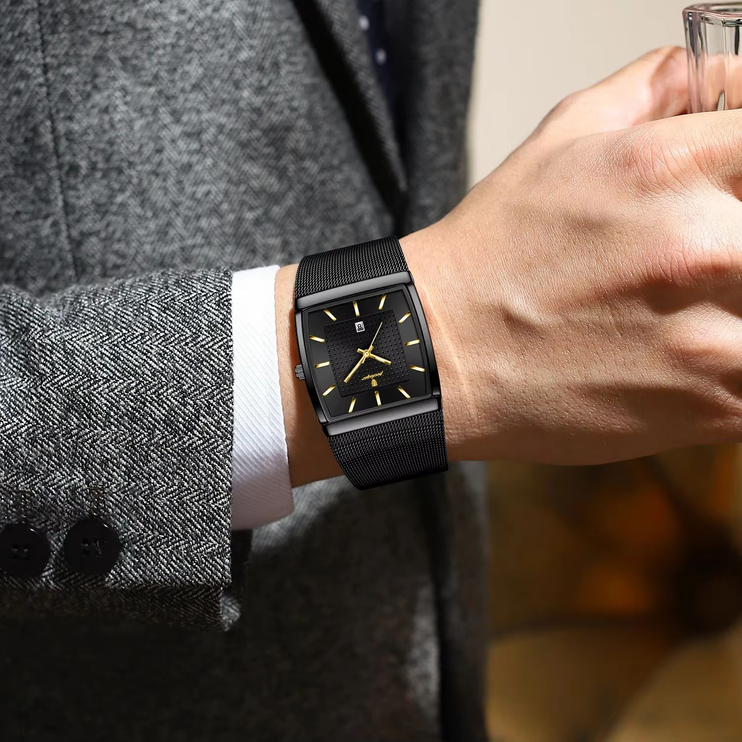 Black rectangular POEDAGAR 885 Quartz Analog Watch with mesh strap worn on a wrist.
