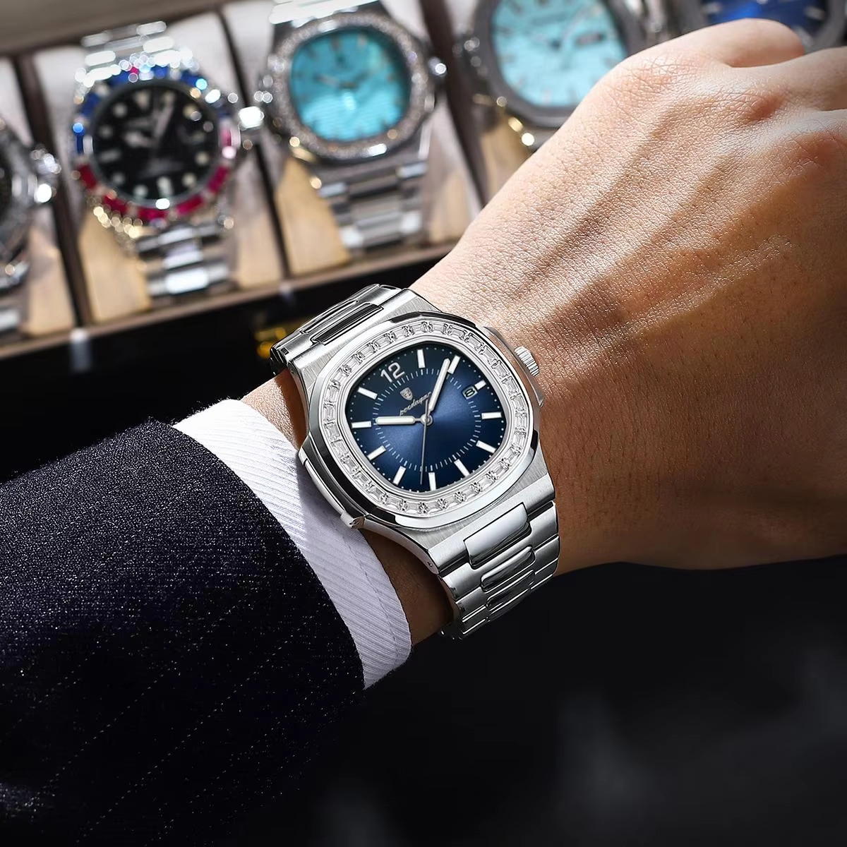 Person wearing a stainless steel POEDAGAR 918 Quartz Analog Watch with a blue dial.