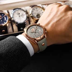POEDAGAR 989 Quartz Chronograph Watch worn on wrist with grey dial and leather band.