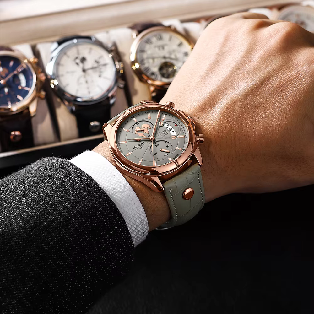 POEDAGAR 989 Quartz Chronograph Watch worn on wrist with grey dial and leather band.