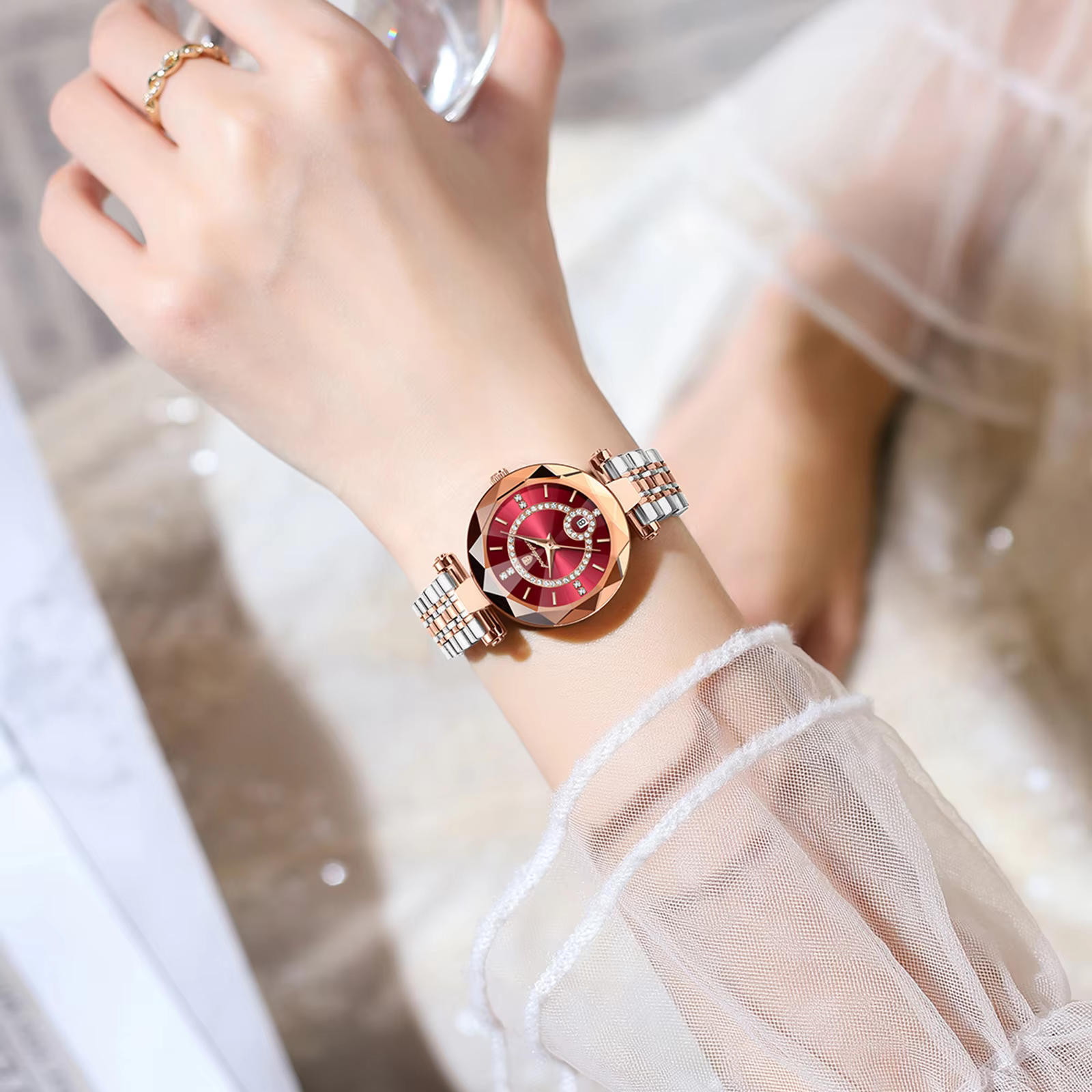 Woman wearing a POEDAGAR 726 Quartz Analog Watch with red dial and two-tone bracelet.