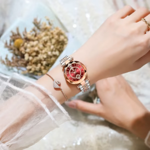 Person wearing the POEDAGAR 726 Quartz Analog Watch with red dial and two-tone bracelet.