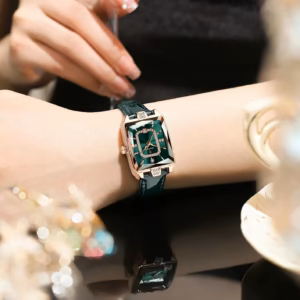 POEDAGAR 785L Quartz Analog Watch with green dial and green leather strap on wrist.