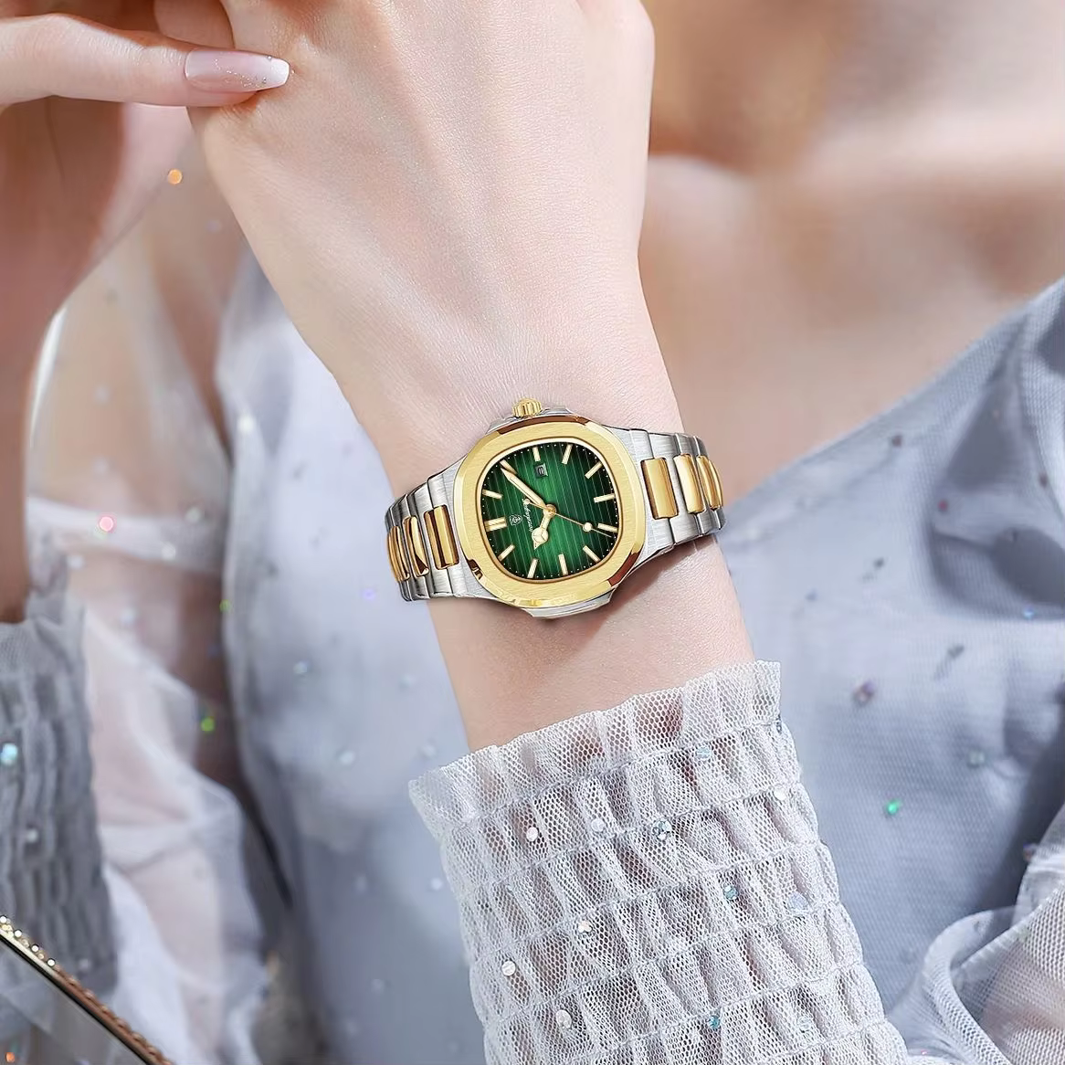 Woman wearing a POEDAGAR 789 Quartz Analog Watch with green dial and two-tone bracelet.