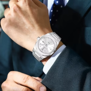 Silver stainless steel POEDAGAR 825 Quartz Analog Watch worn on a wrist.