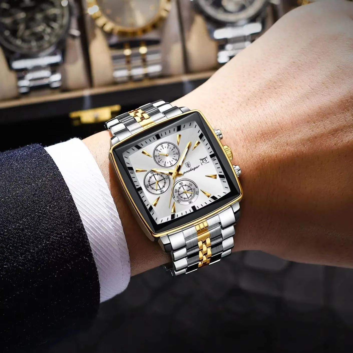 Silver and gold POEDAGAR 866 Quartz Chronograph Watch worn on a wrist.