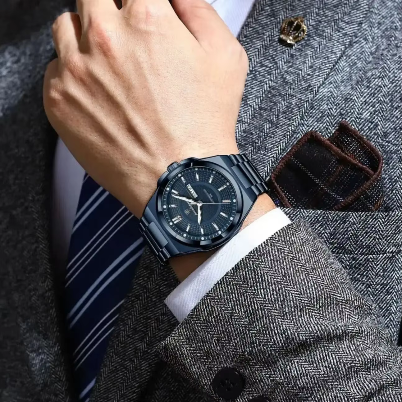 Dark blue POEDAGAR 896 Quartz Analog Watch worn on a wrist with a grey suit.