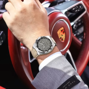 POEDAGAR 896L Quartz Analog Watch worn on wrist holding a red steering wheel.