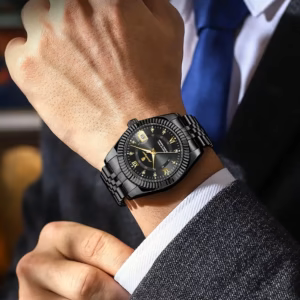 Black POEDAGAR 910 Quartz Analog Watch with gold details worn on a man's wrist.