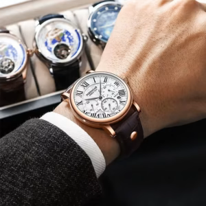 Person wearing POEDAGAR 986 Quartz Chronograph Watch with white dial and brown leather strap.